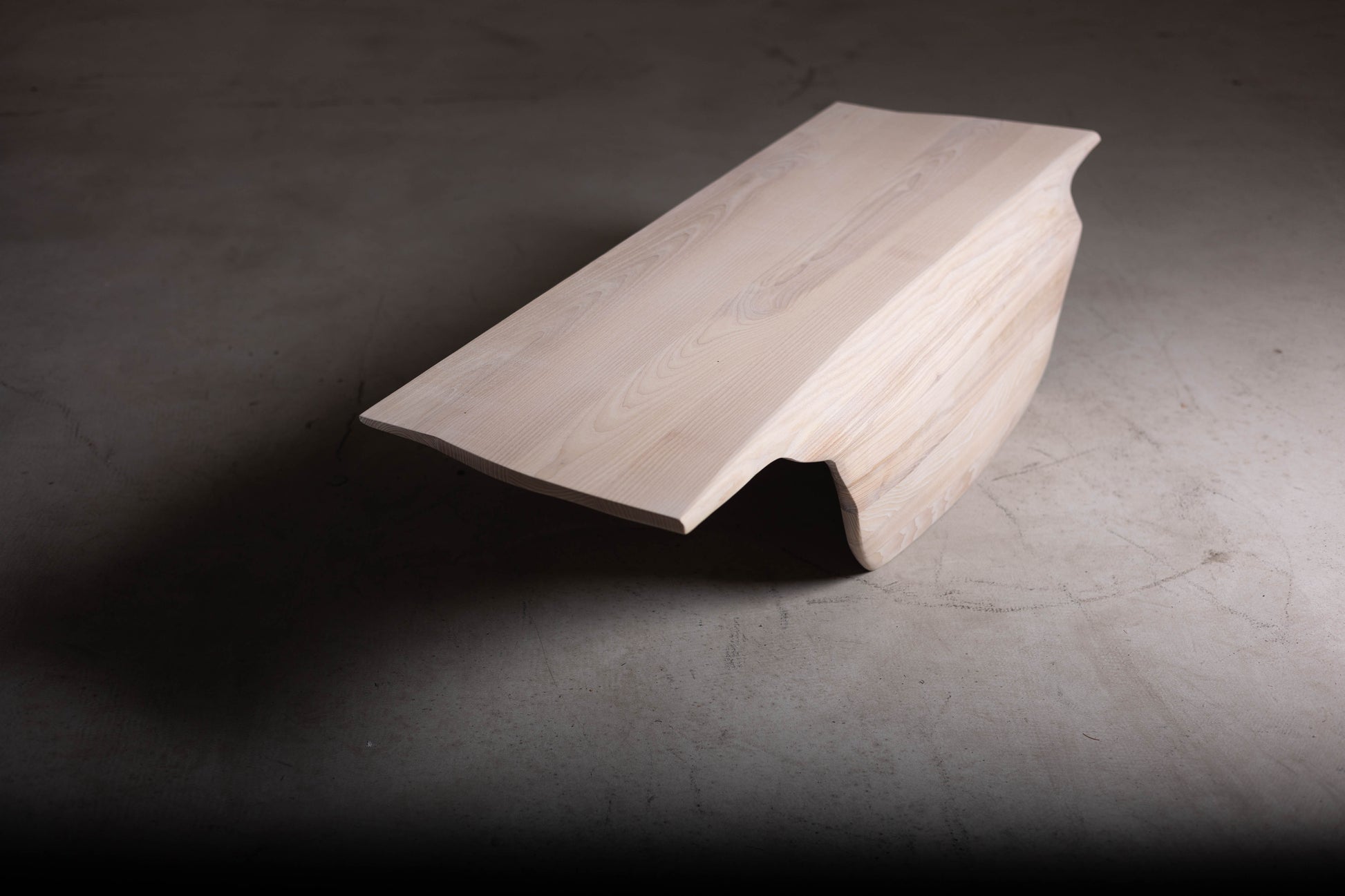 Sculptural Solid Wood Coffee Table EM111 Part Of Erosio Collection | Angled front view showcasing the fluid shape.