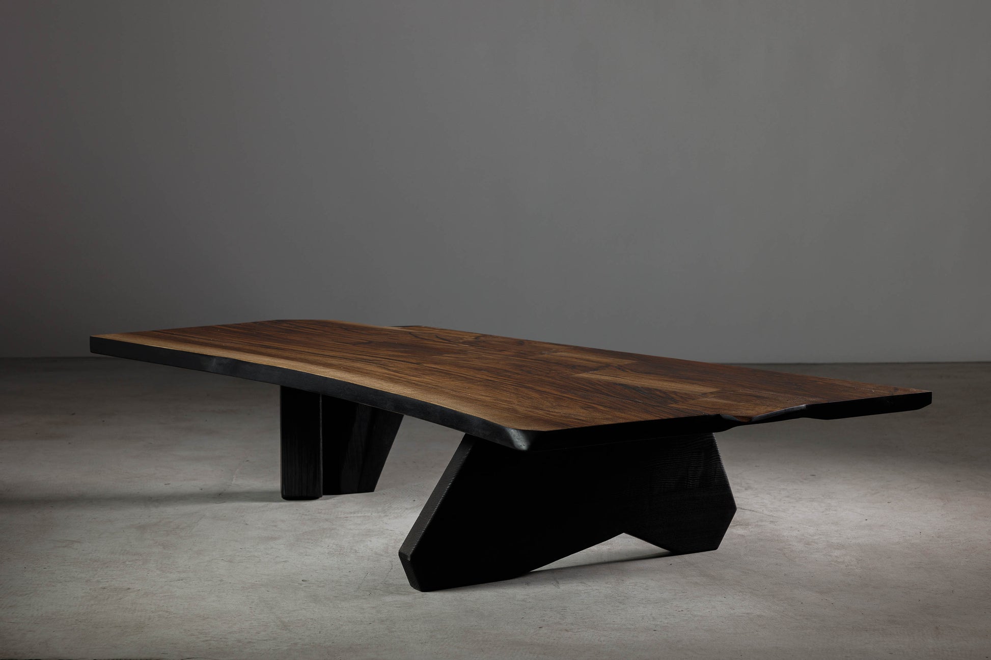 Wabi Sabi Inspired Walnut Coffee Table EM104 Part Of 18Brut Collection | Angled shot showcasing the walnut slab and the charred ash base. 