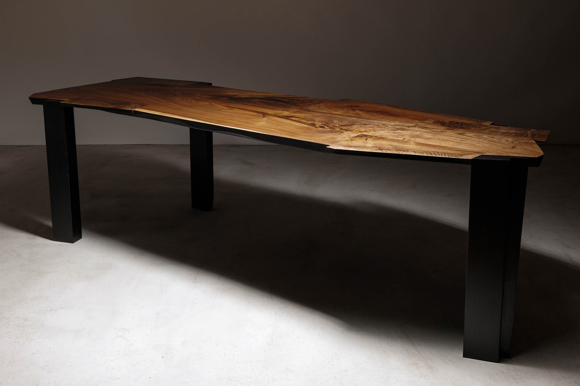 EM201 Of 18Brut Collection | Sideview image of the table in a dimmed light. 