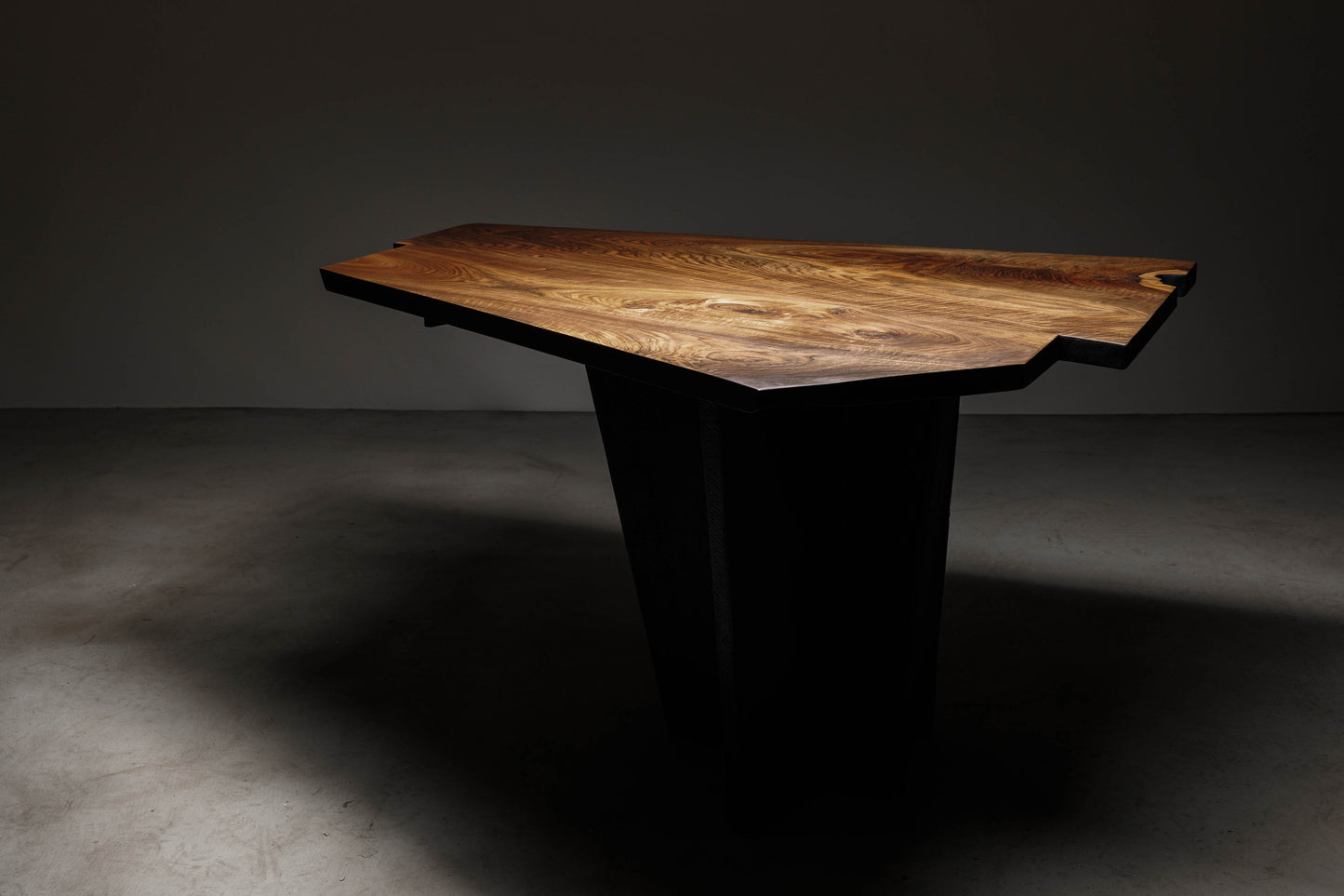 EM205 Of 18Brut Collection | Walnut Dining Table For 4 | Image in ambiental light showcasing the tabletop.