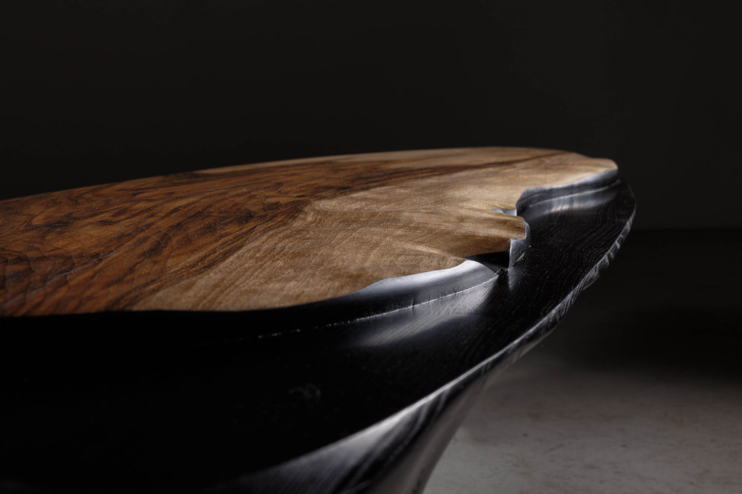 Sculptural Walnut Coffee Table EM110 Part Of Erosio Collection | Close-up image on the level showing the walnut slab sitting proudly on the sculptural base. 